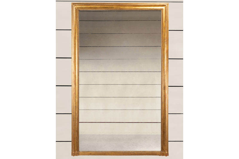 Miroir Napoléon III en bois doré et sculpté, H.170 L.110