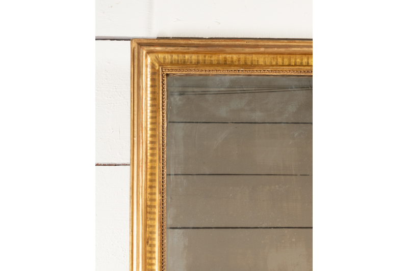Miroir Napoléon III en bois doré et sculpté, H.170 L.110